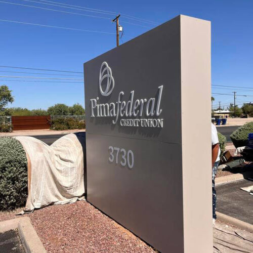 Completed Tucson painting project showcasing professional commercial signage by Piper Family Painting.
